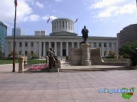 The State Capital building in downtown Columbus, Ohio with statues out in front.